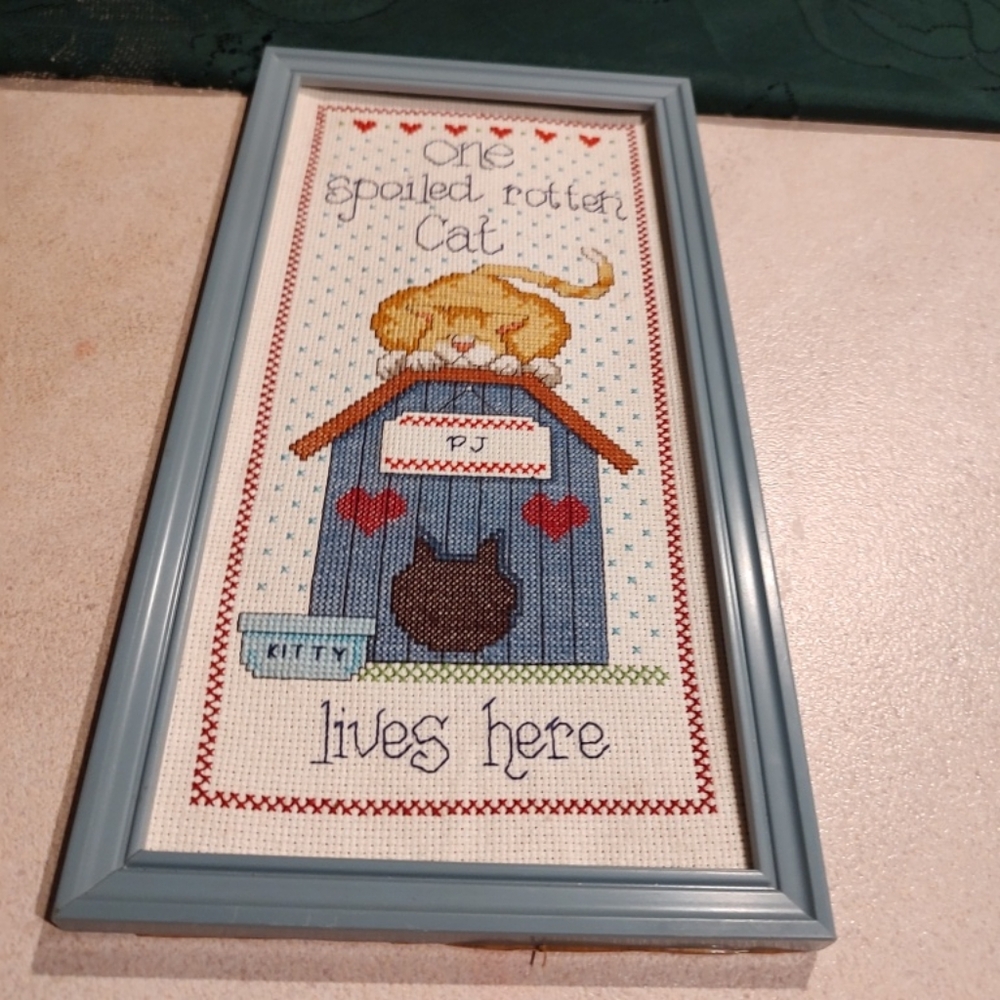 beautiful 7"x13" framed cross stitch piece is a must-have for any cat lover.